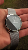 Calvin Klein Minimalist Black Dial Silver Mesh Bracelet Watch for Men - K3M2112X