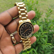 Movado Series 800 Black Dial Gold Steel Strap Watch For Men - 2600145